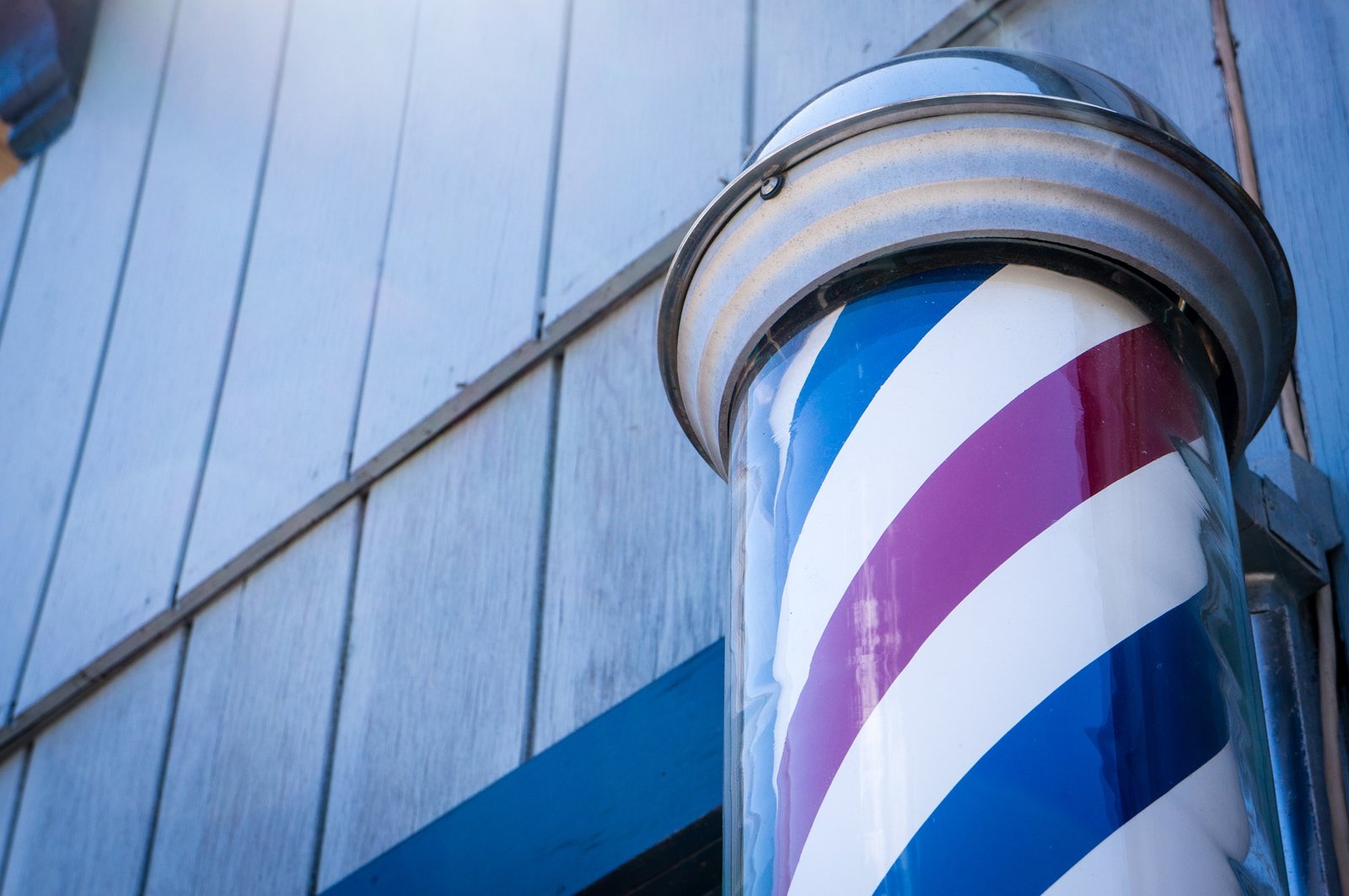 Classic barber pole and storefront